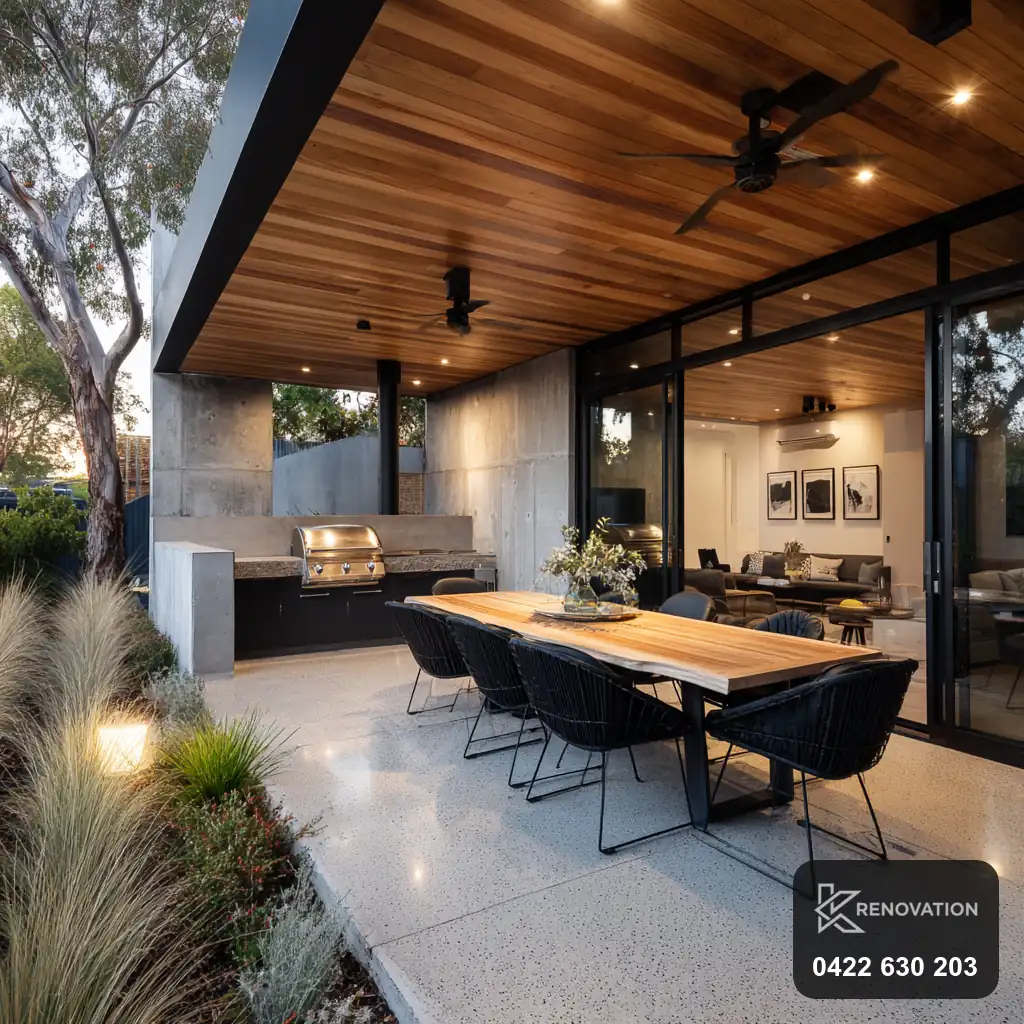 Alfresco dining extension with timber ceiling and built-in bench seat by KRenovation