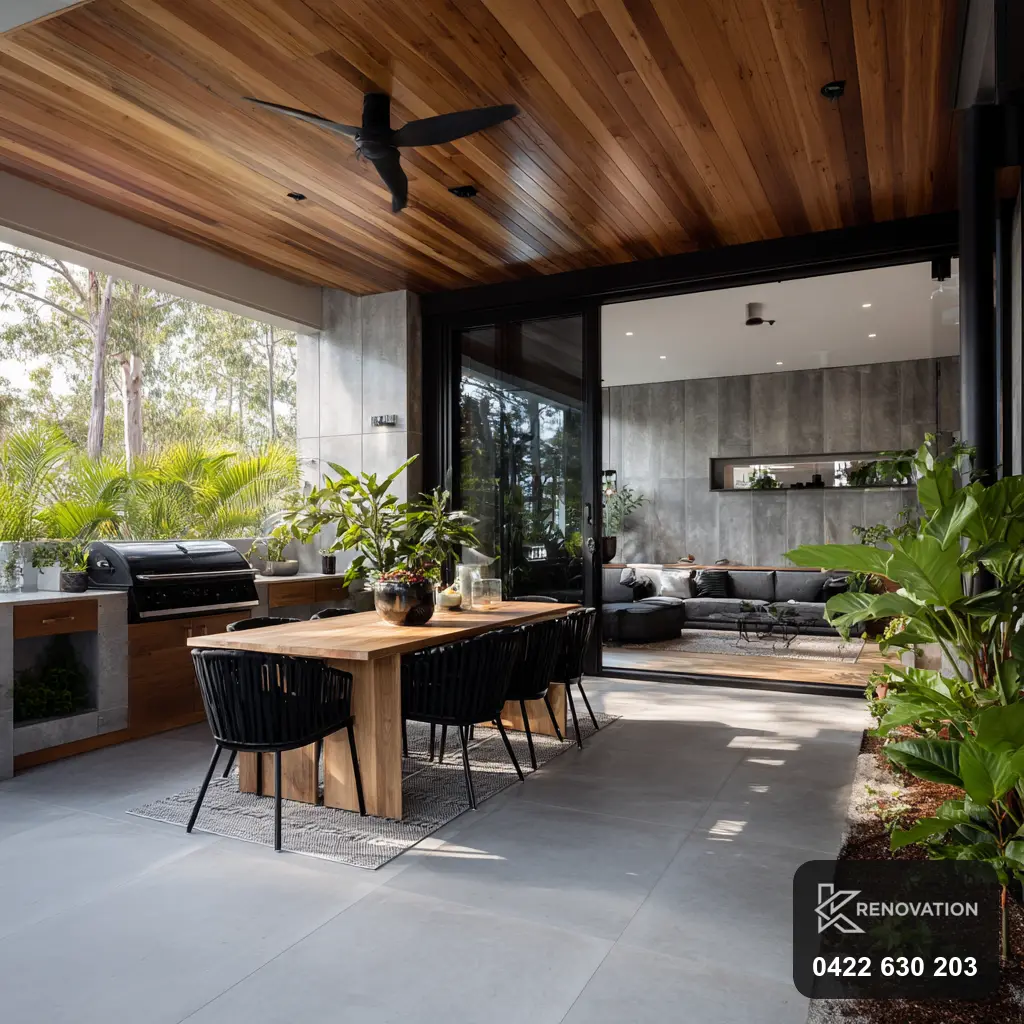 Covered alfresco living and dining extension opening to the garden by KRenovation