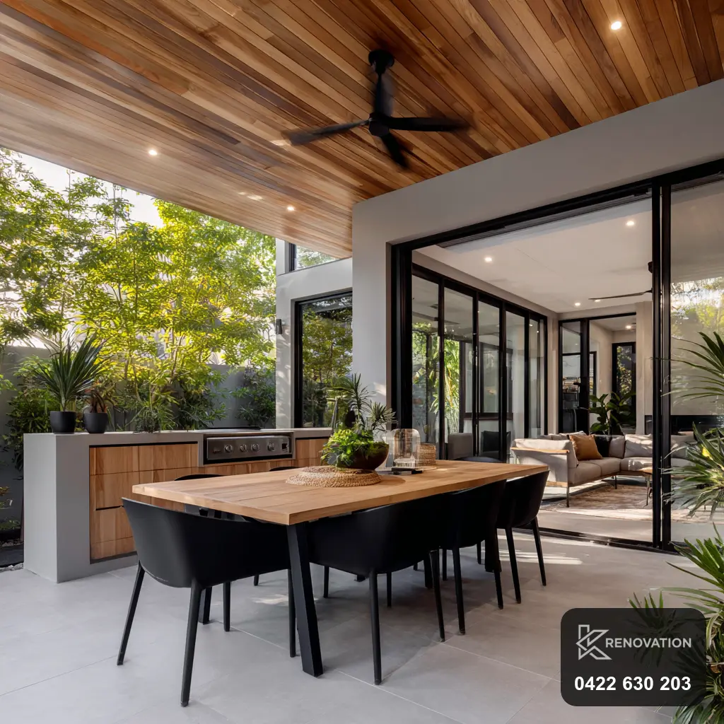 Indoor-outdoor dining with sliding doors in a Hoppers Crossing home by KRenovation