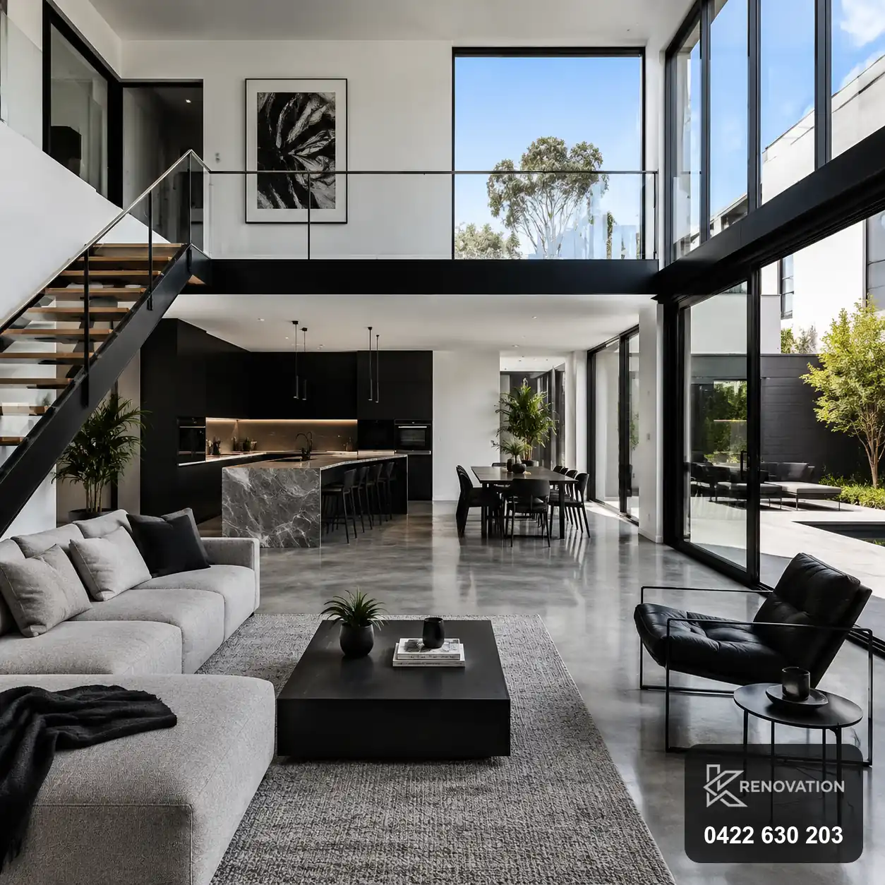 Double-height living void with black-framed glazing in a Spotswood home by KRenovation