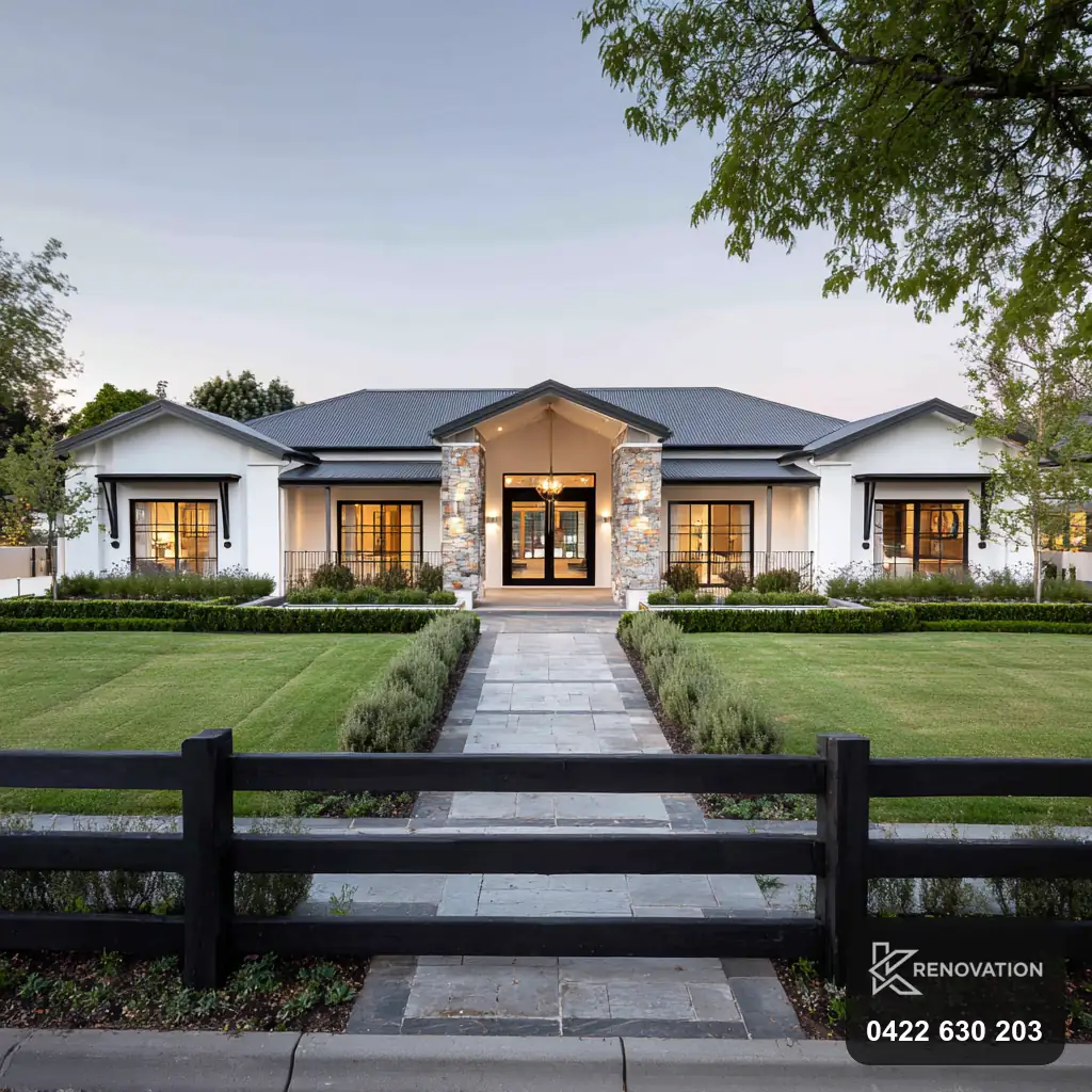 Hamptons-style single-storey facade with symmetrical hedged path by KRenovation