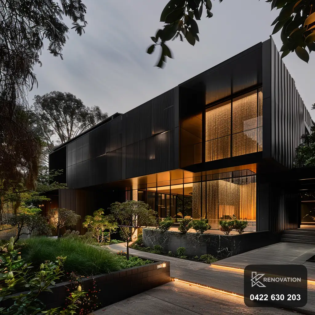 Extended dark timber home lit at dusk by KRenovation