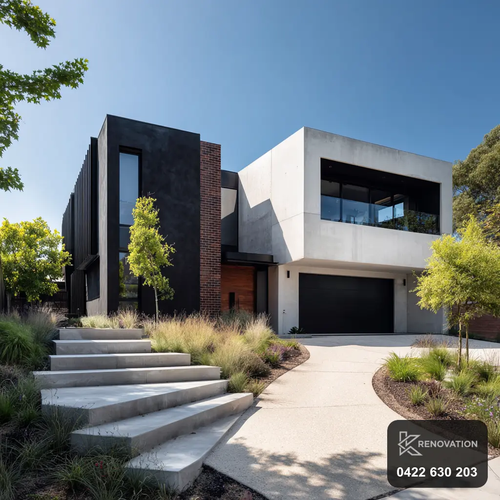 Renovated facade in dark and white render with a landscaped path by KRenovation
