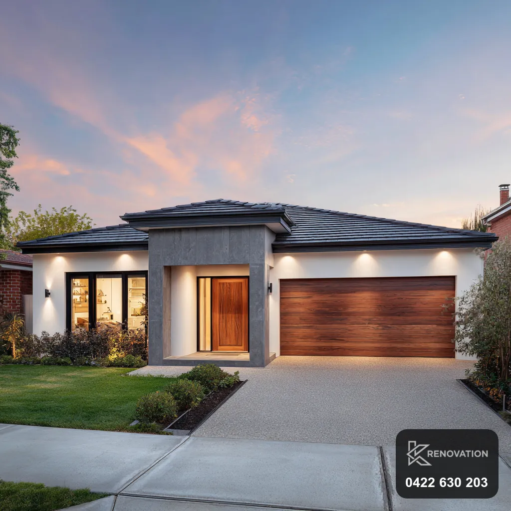 Extended home with render and timber facade and driveway at dusk by KRenovation