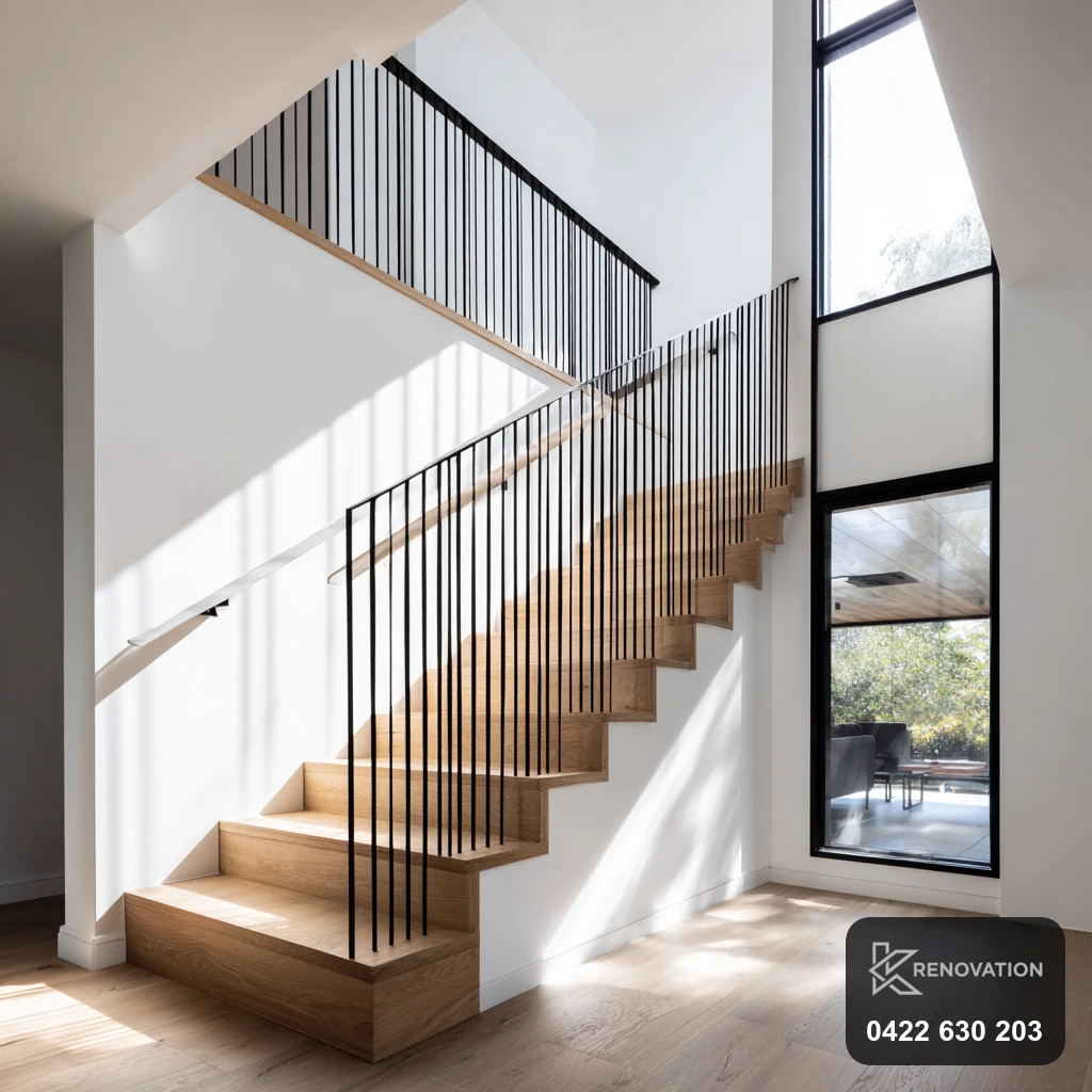 Timber staircase with black steel balustrade in a Spotswood renovation by KRenovation