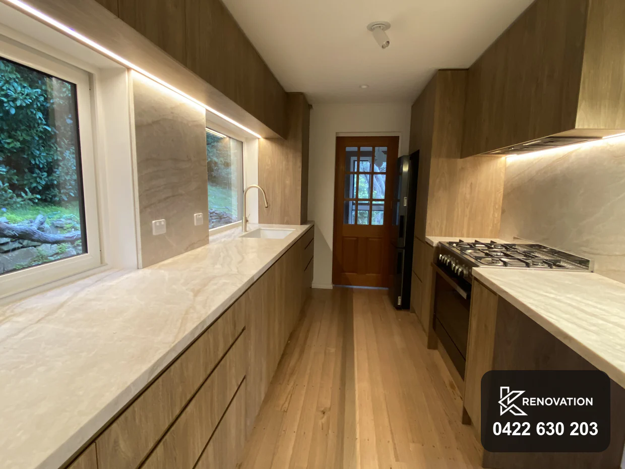 Finished oak and stone galley kitchen after the Essendon renovation