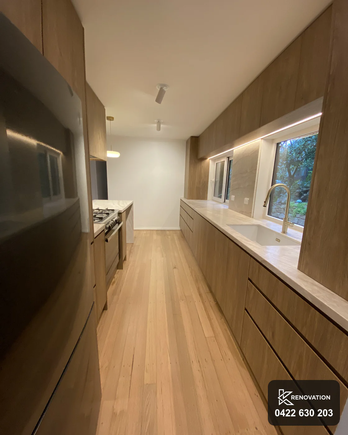 Raked ceiling above the finished oak kitchen in an Essendon renovation