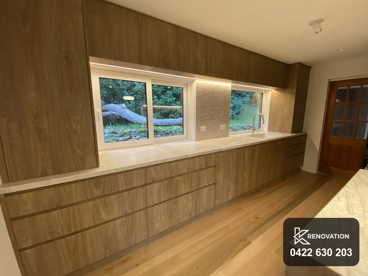 Finished Essendon renovation looking down the galley toward the timber entry door